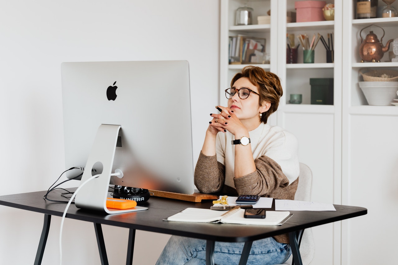 https://www.pexels.com/photo/focused-female-employee-reading-information-on-computer-in-office-4491443/