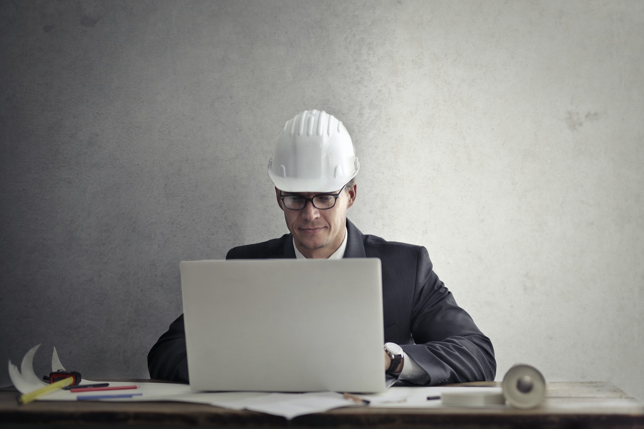 https://www.pexels.com/photo/engineer-working-with-laptop-at-table-3769135/