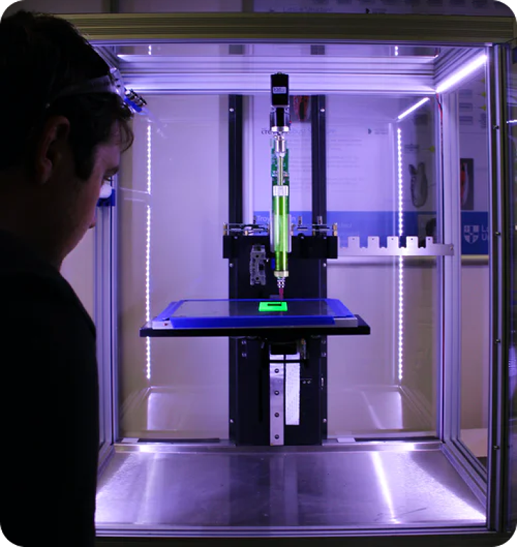 person near 3D printer